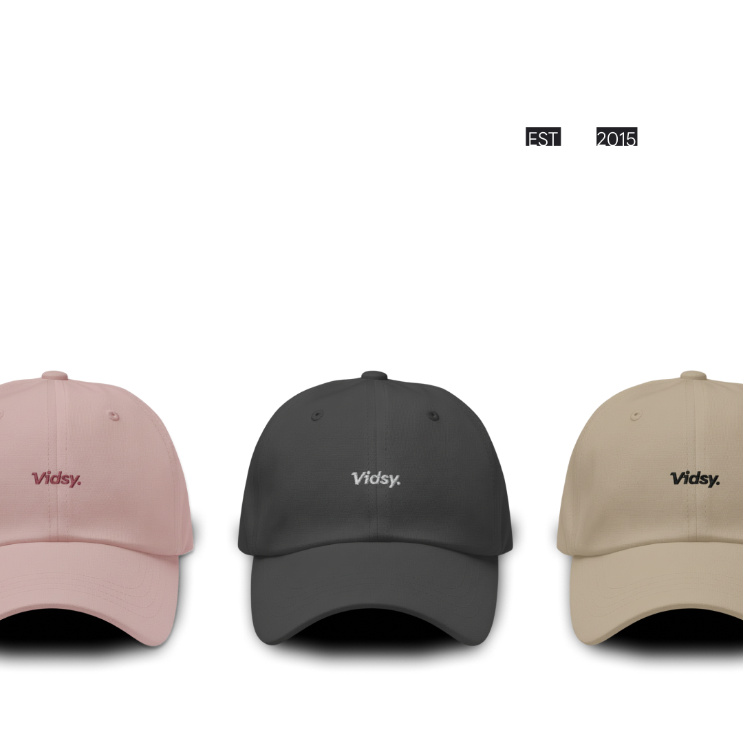 Vidsy branded caps in pink, charcoal and tan, established 2015
